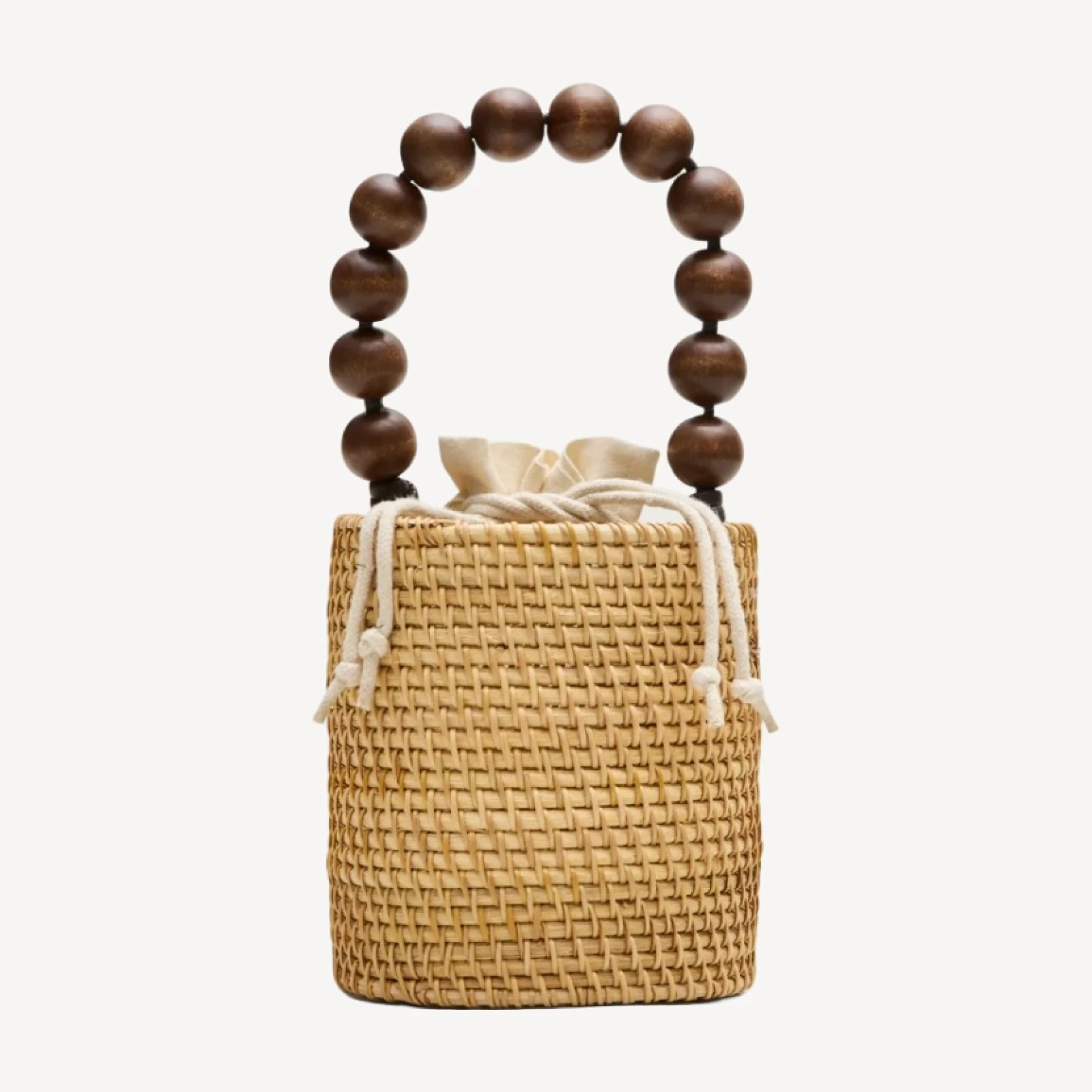 Handknotted rattan bucket bag with wood beads