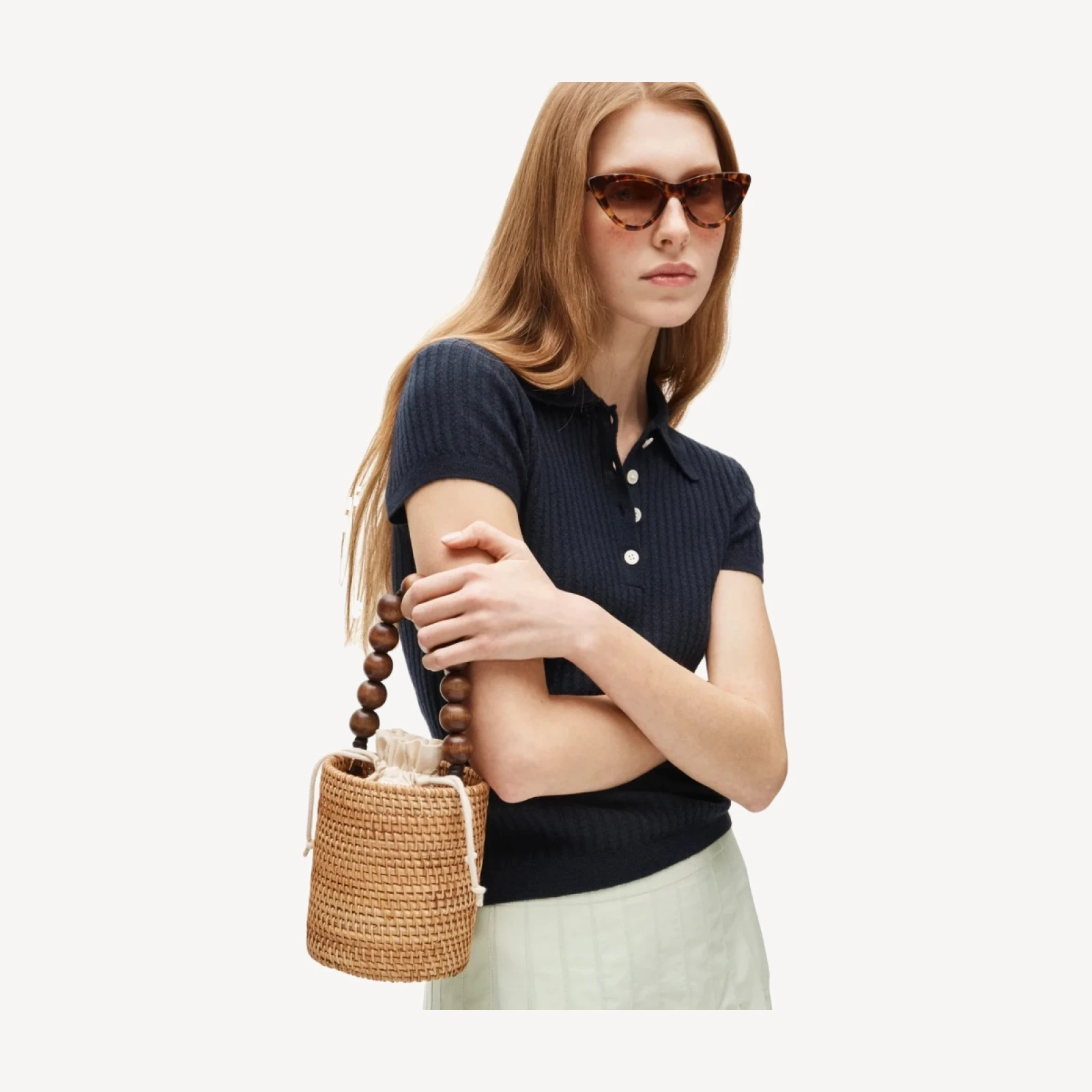 Handknotted rattan bucket bag with wood beads