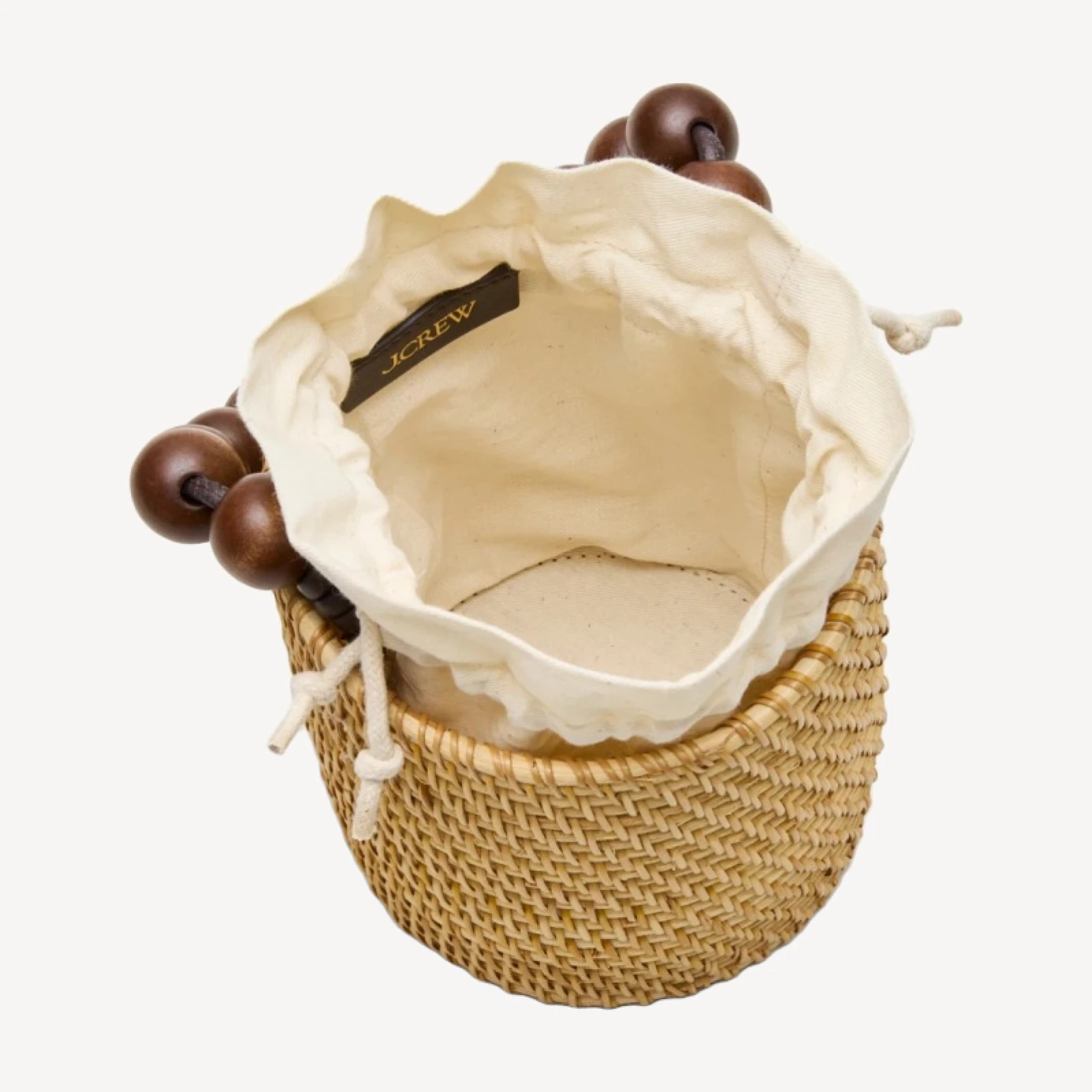 Handknotted rattan bucket bag with wood beads