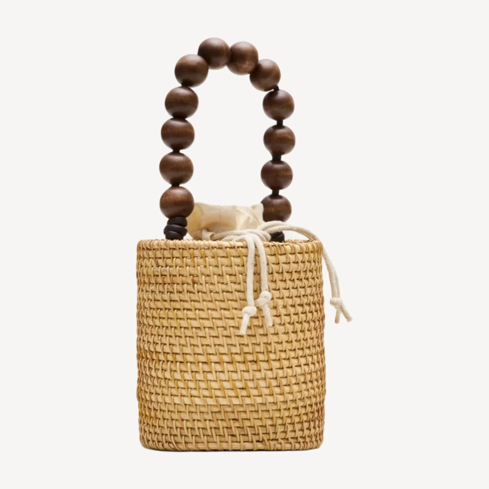 Handknotted rattan bucket bag with wood beads