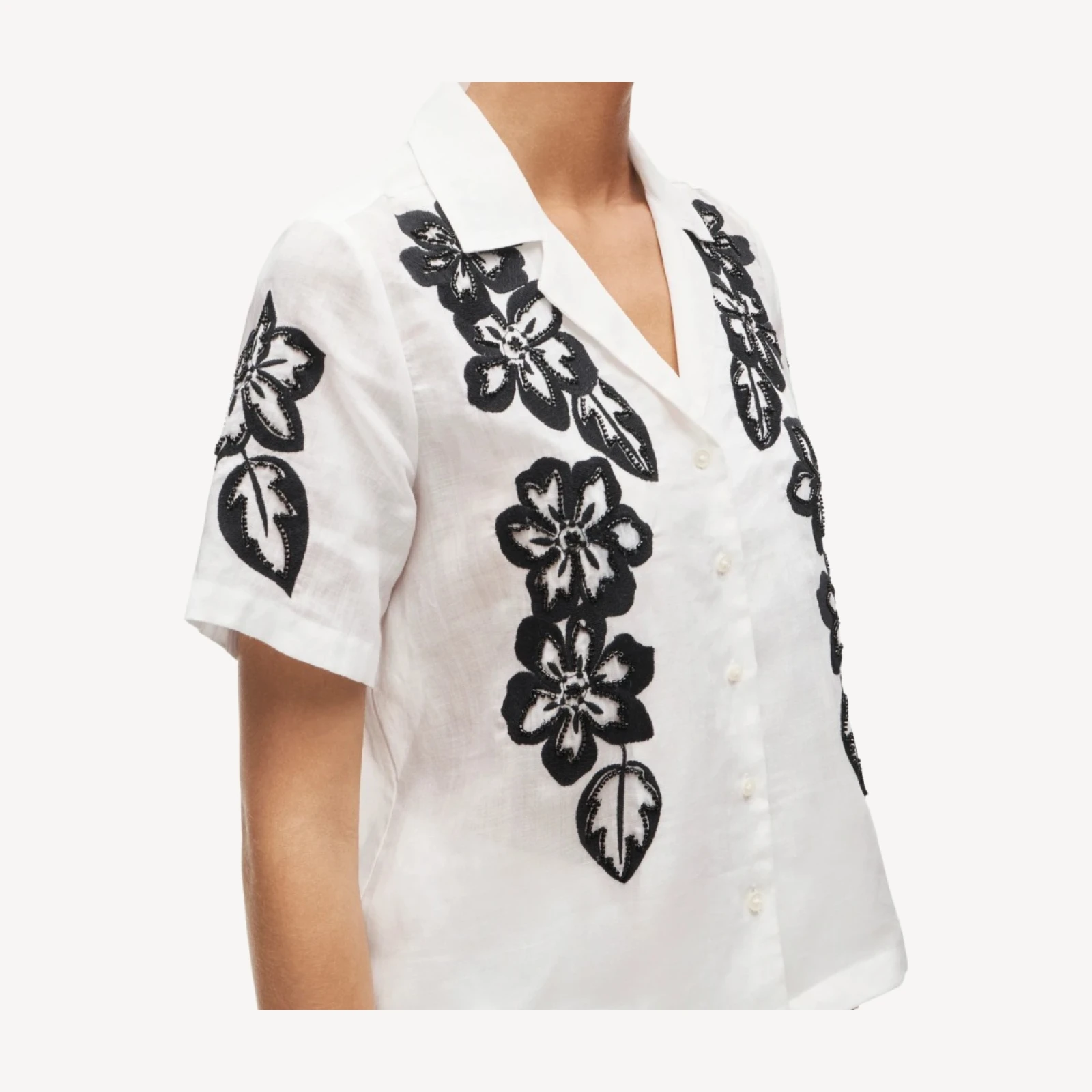 Short-sleeve button-up top in beaded floral