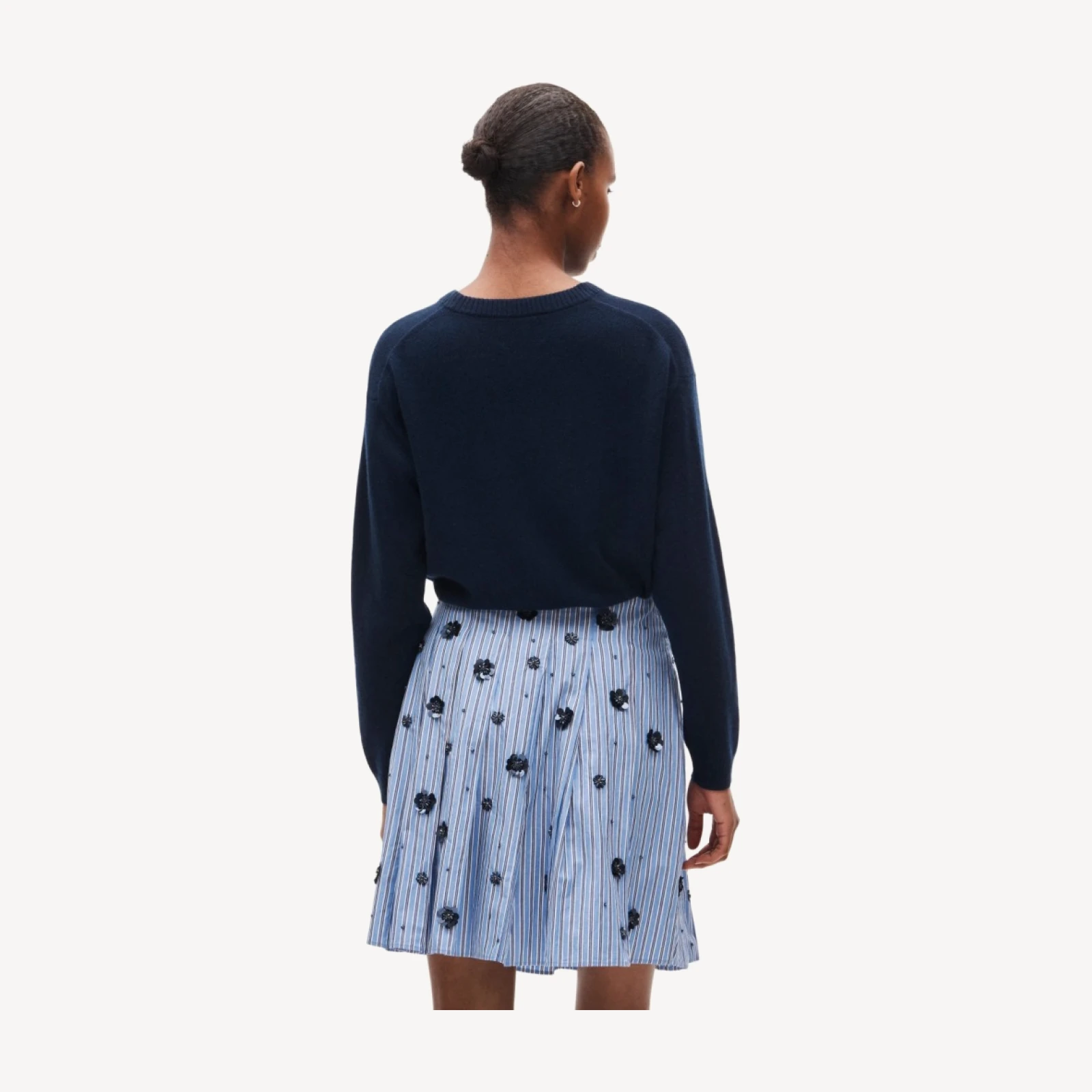 Pleated prep skirt in stripe with floral embellishments
