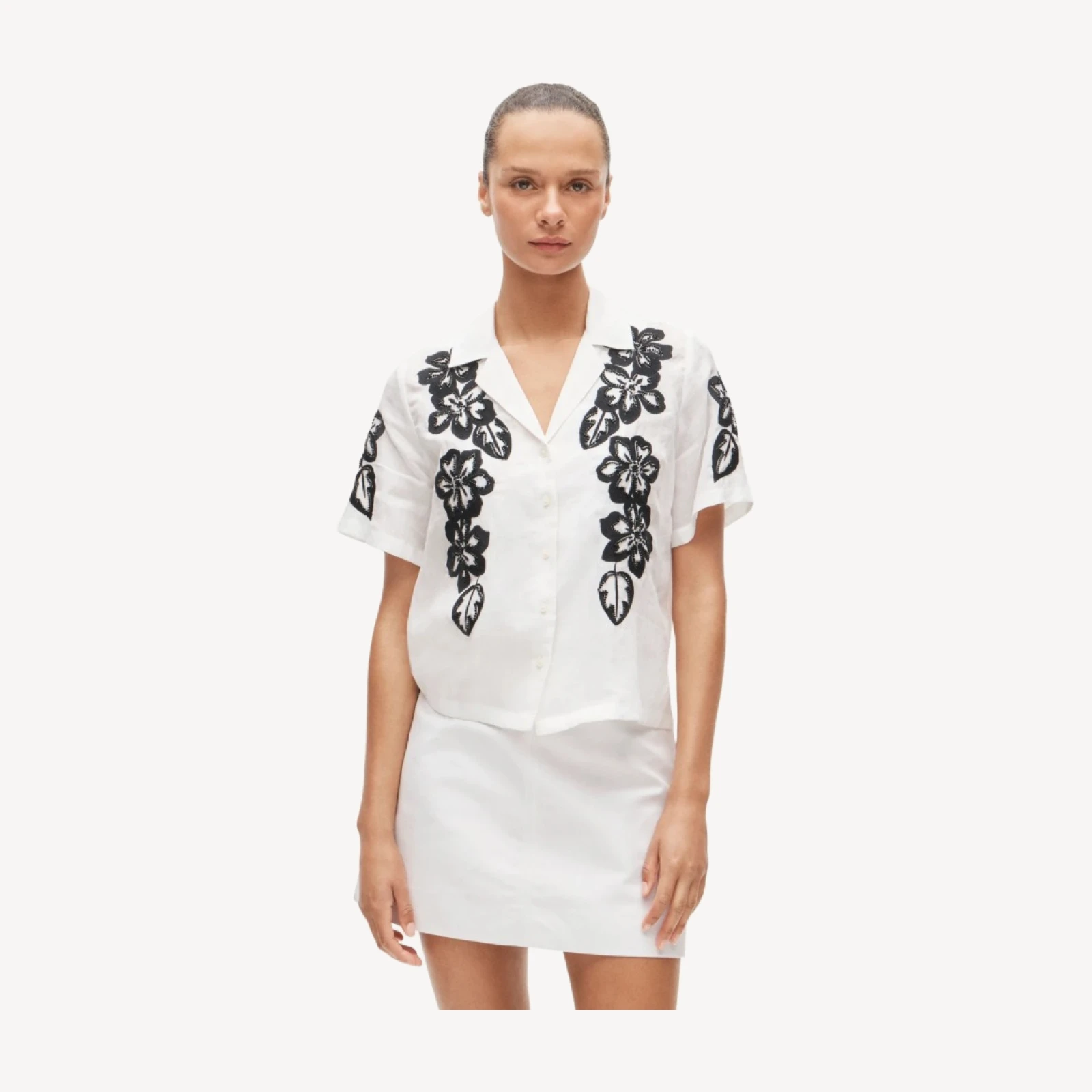 Short-sleeve button-up top in beaded floral