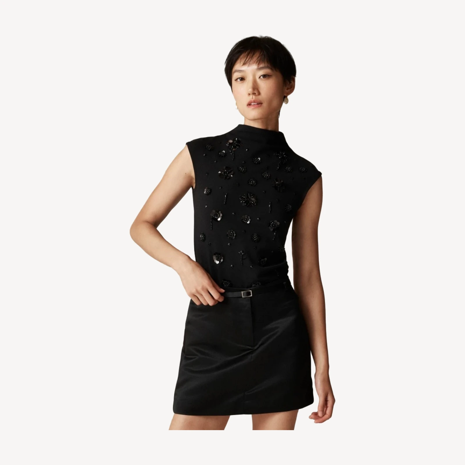 Stretch cotton-blend mockneck with floral embellishment