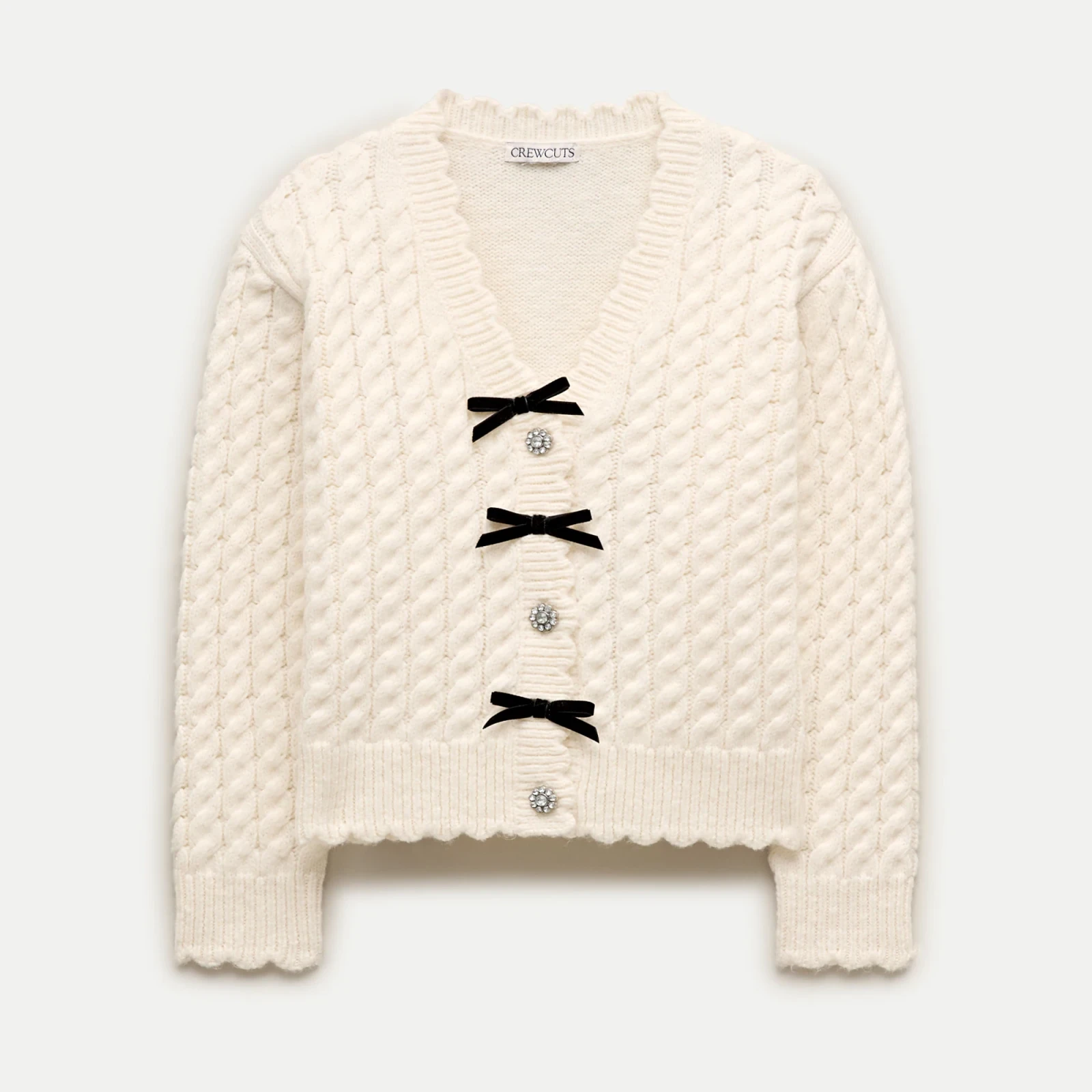 Girls' bow cable-knit cardigan in Supersoft yarn
