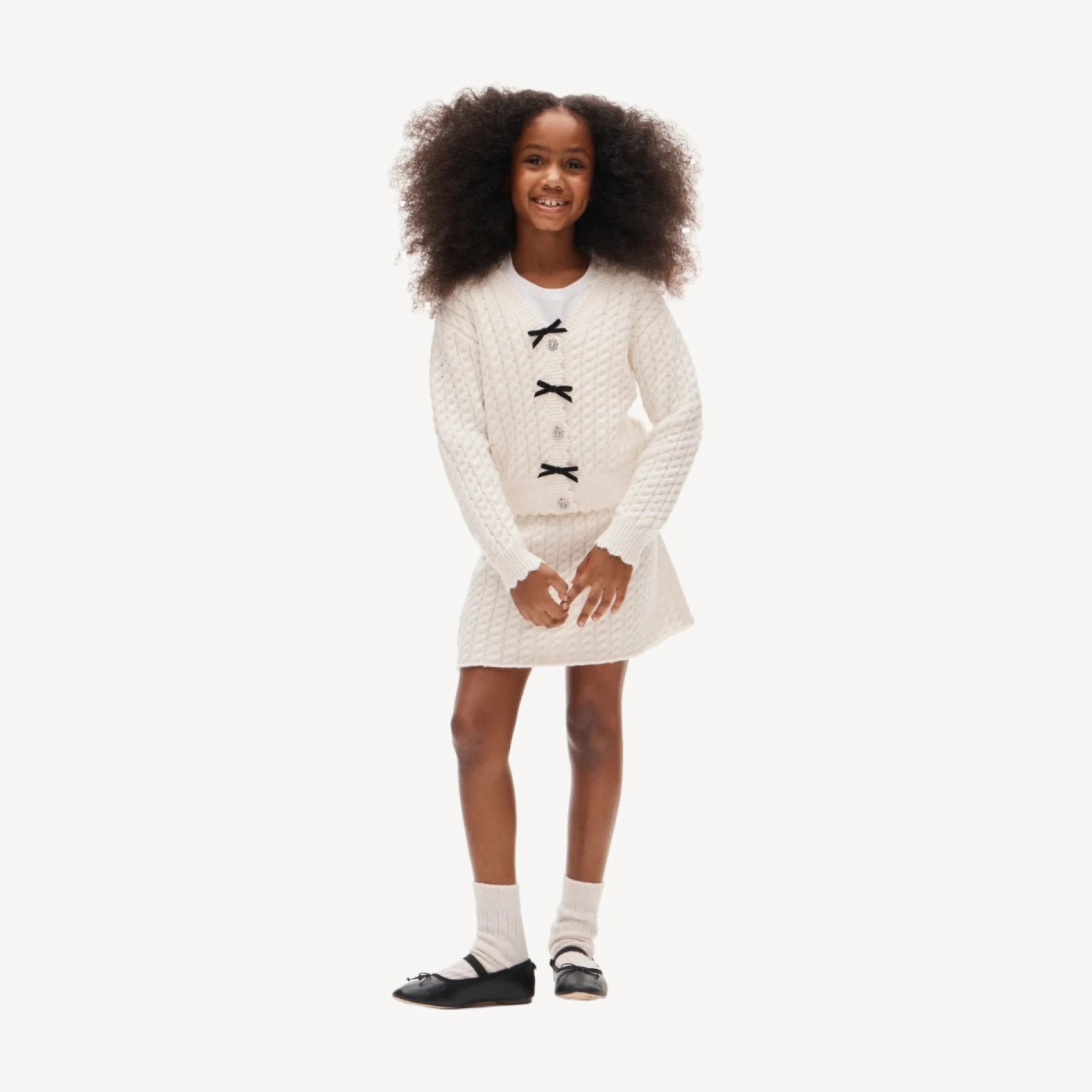 Girls' bow cable-knit cardigan in Supersoft yarn