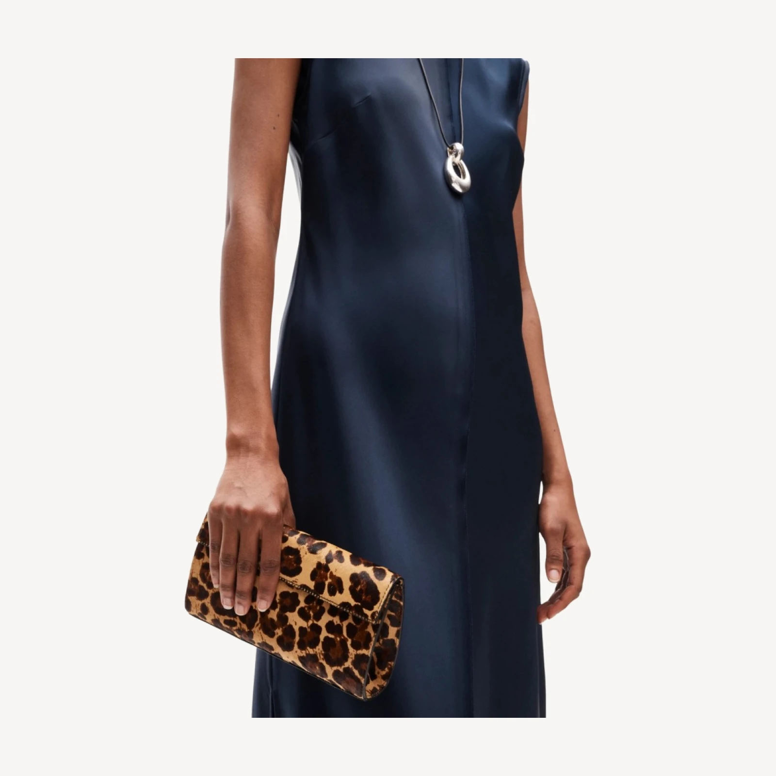 Structured clutch in leopard-print calf hair